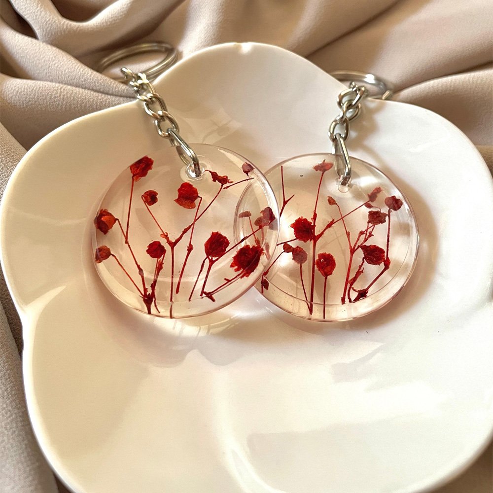 Handmade clear resin keychains with real red dried flowers inside silver chains
